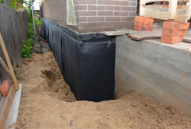 Happy homeowners after waterproofing job in Halstead